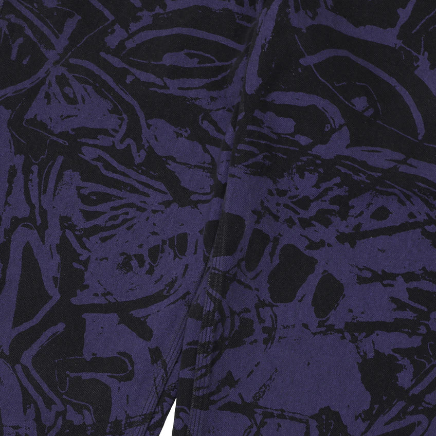 Close-up of a patterned fabric with black and white design on a dark background