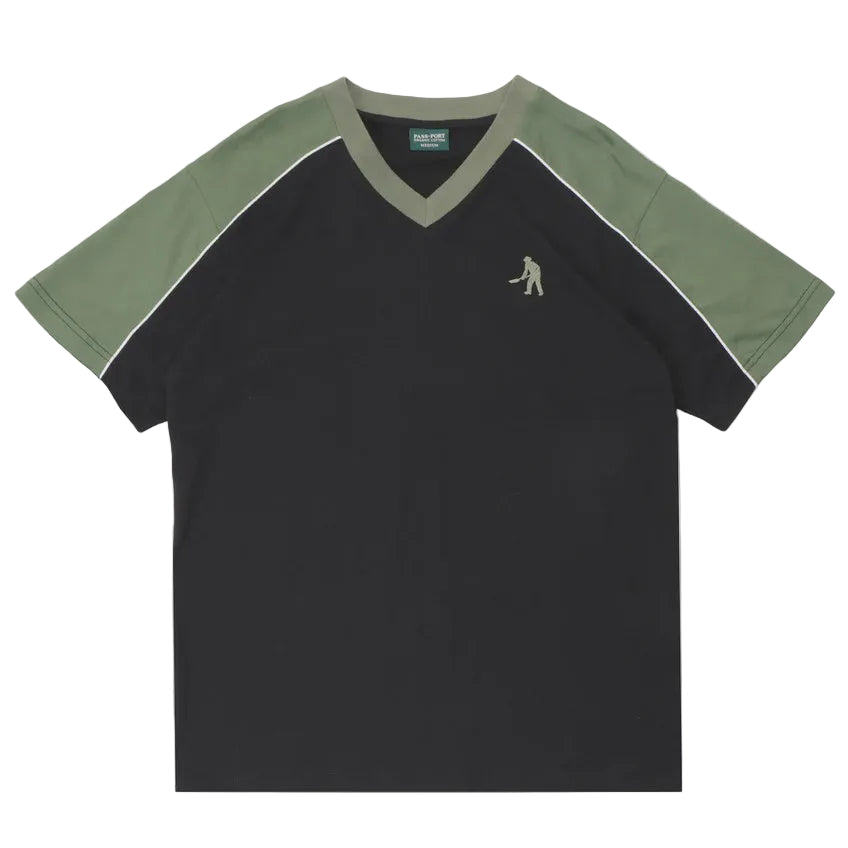 Black t-shirt with green sleeves and collar on a white background