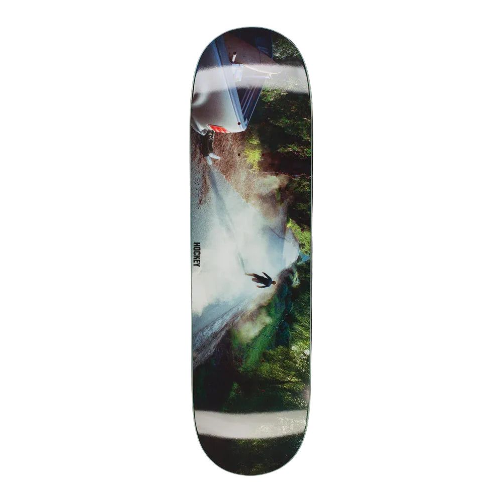 Skateboard deck with a nature-themed design on a white background