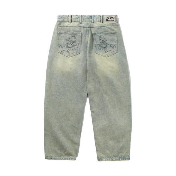 Light blue jeans with brand logo on a white background