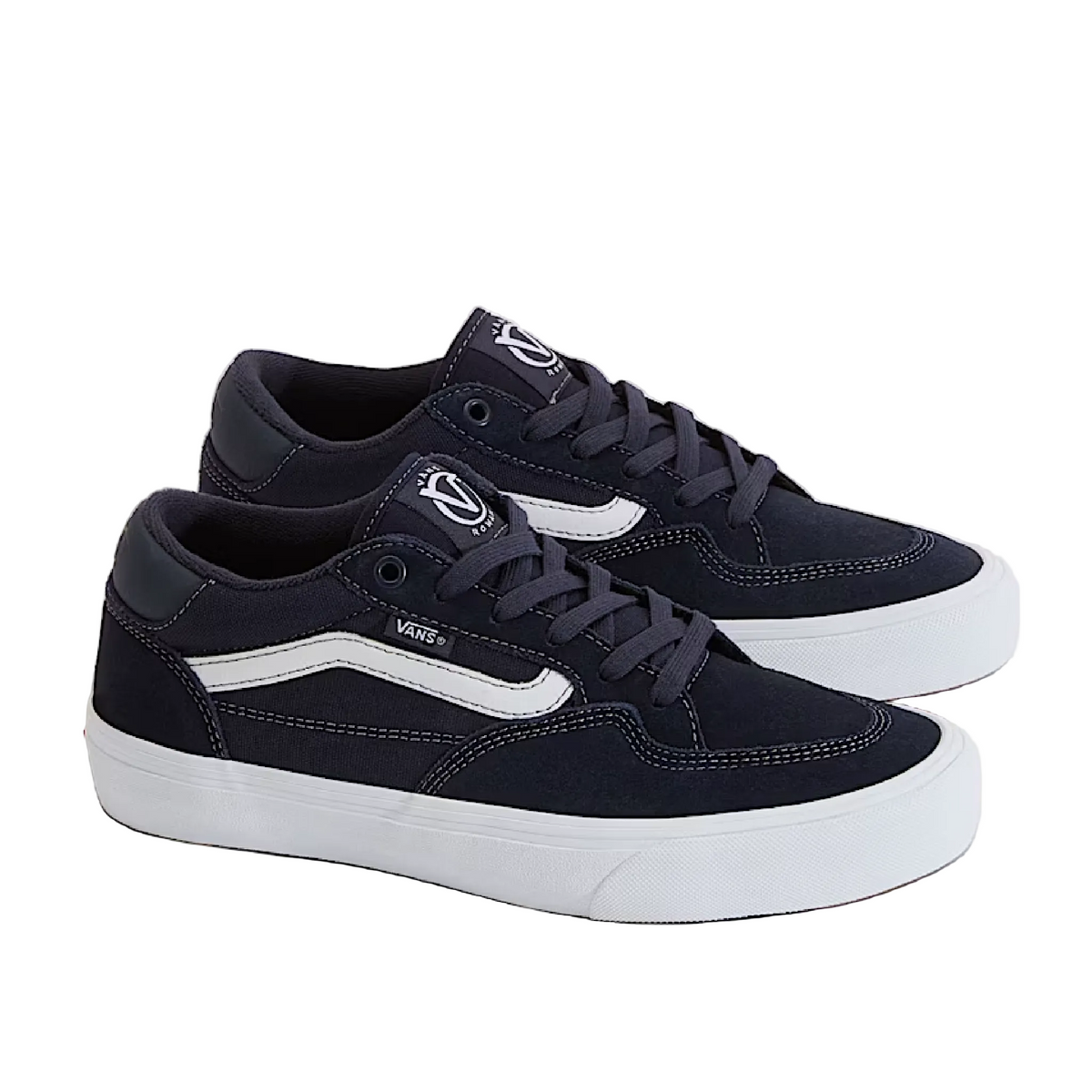 Navy blue sneakers with white soles on a light gray background