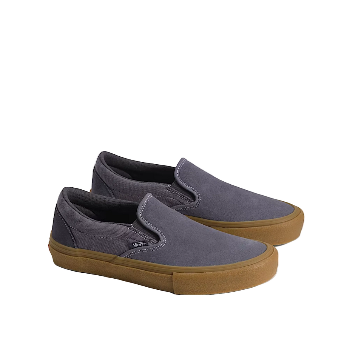 Pair of slip-on shoes with purple uppers and brown soles on a light background