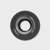 Black skateboard wheel with 'Chocolate' and '51mm' branding on a light gray background