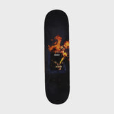Skateboard deck with fiery graphic design on a light gray background