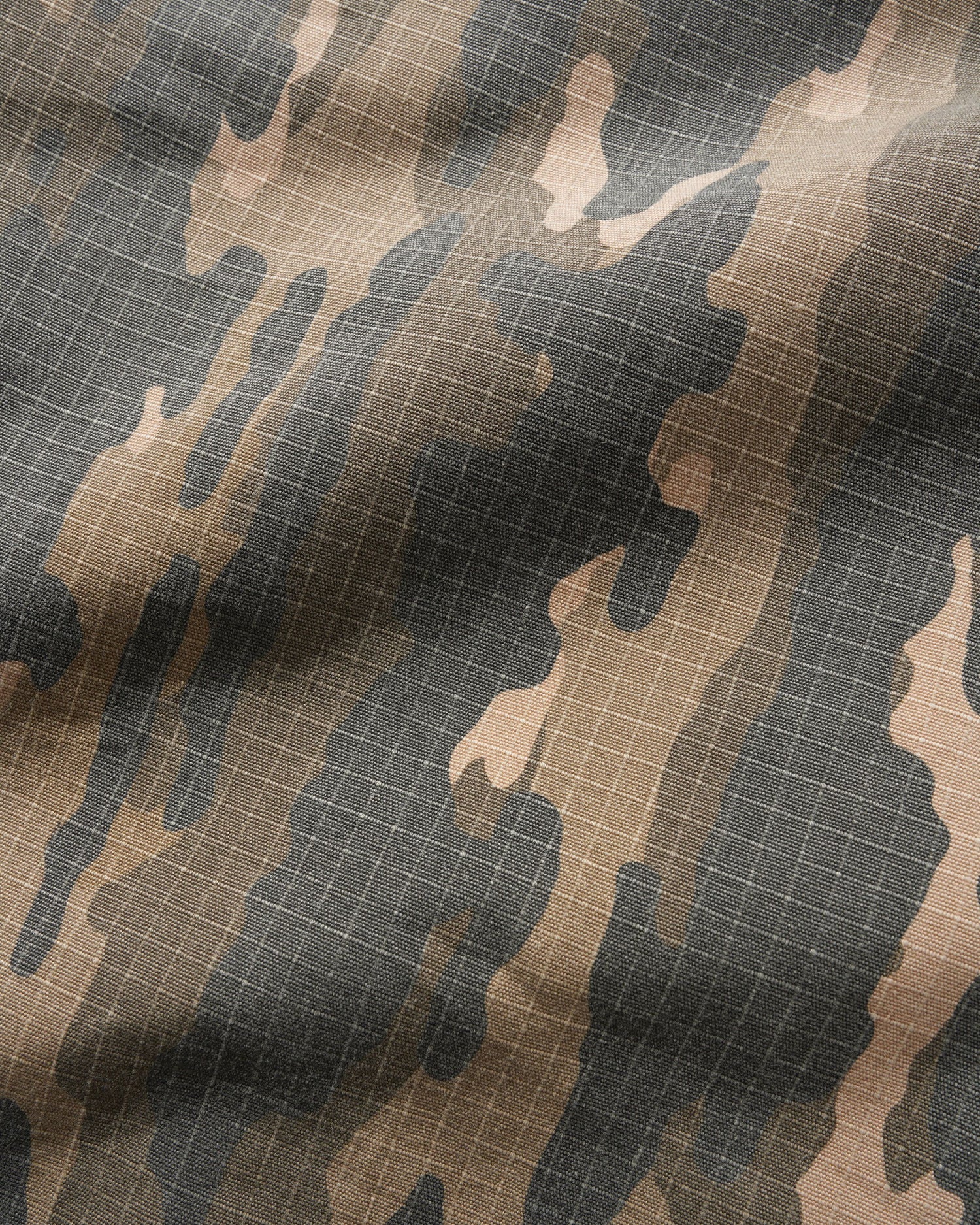Close-up of camouflage fabric with grid pattern