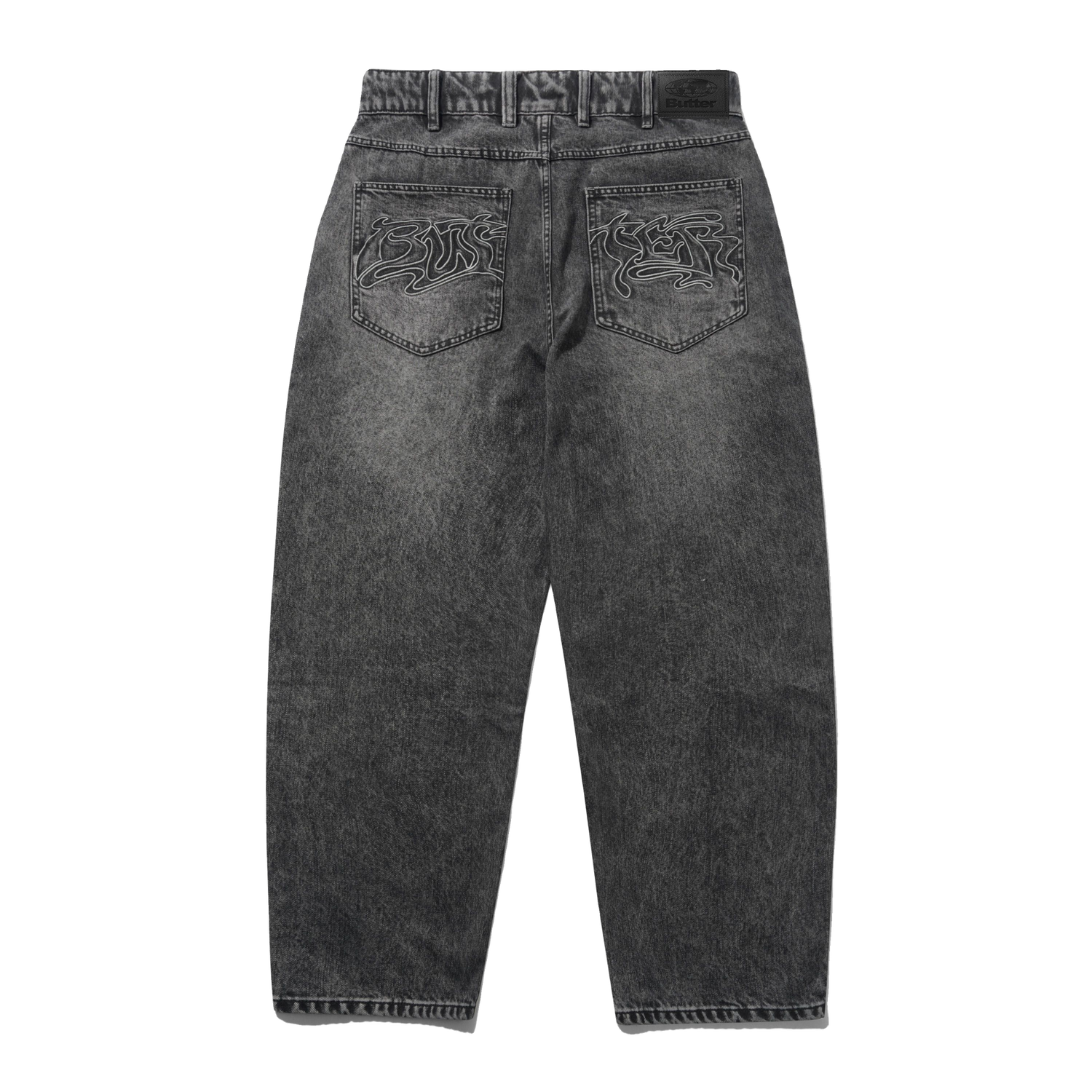 Back view of dark gray acid-wash jeans with embroidered lion designs on the back pockets, shown on a plain white background.