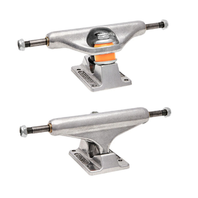 Two silver skateboard trucks on a white background