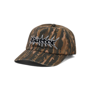 Camouflage-patterned cap with a white logo on a white background