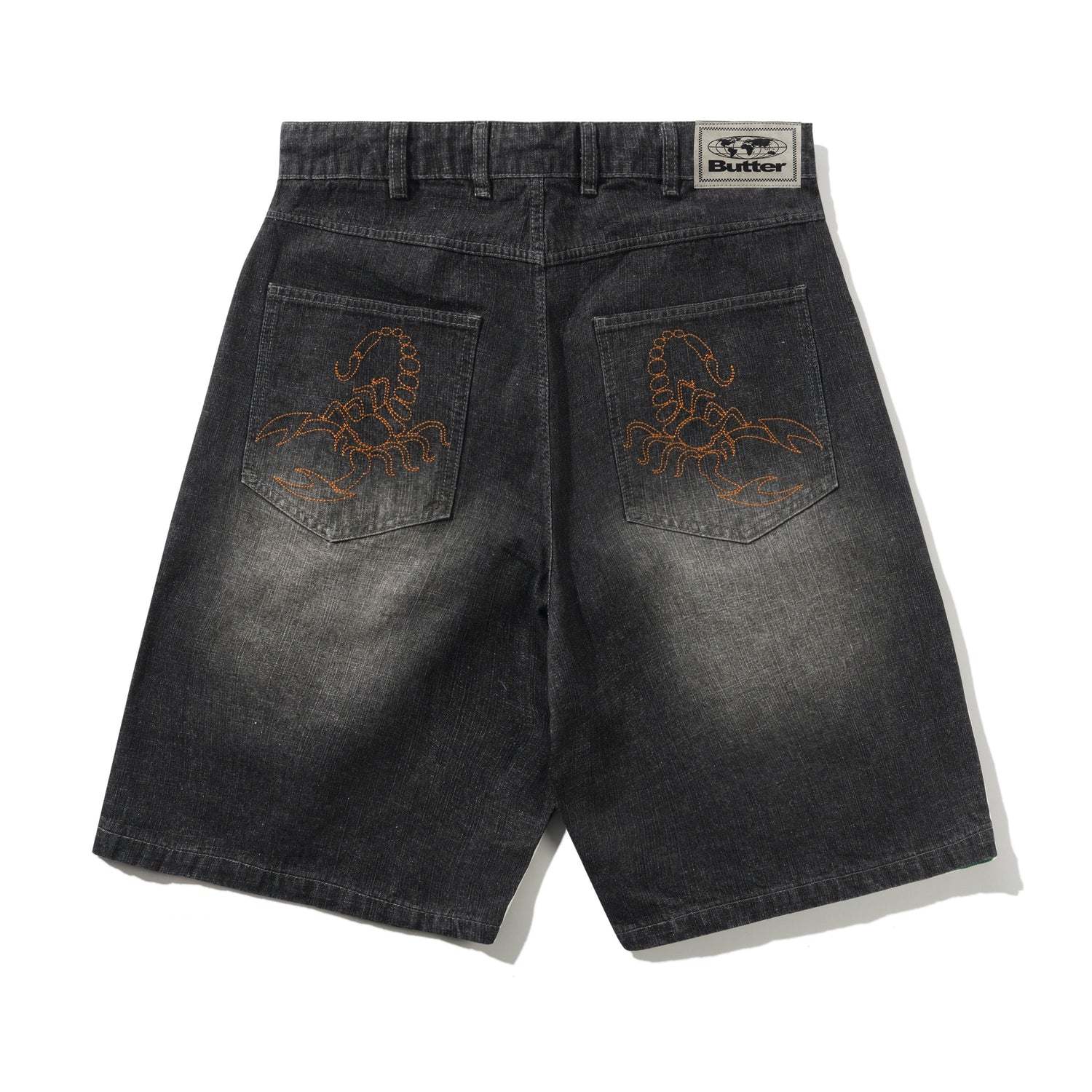 Black denim shorts with embroidered designs on the back pockets, displayed against a white background.