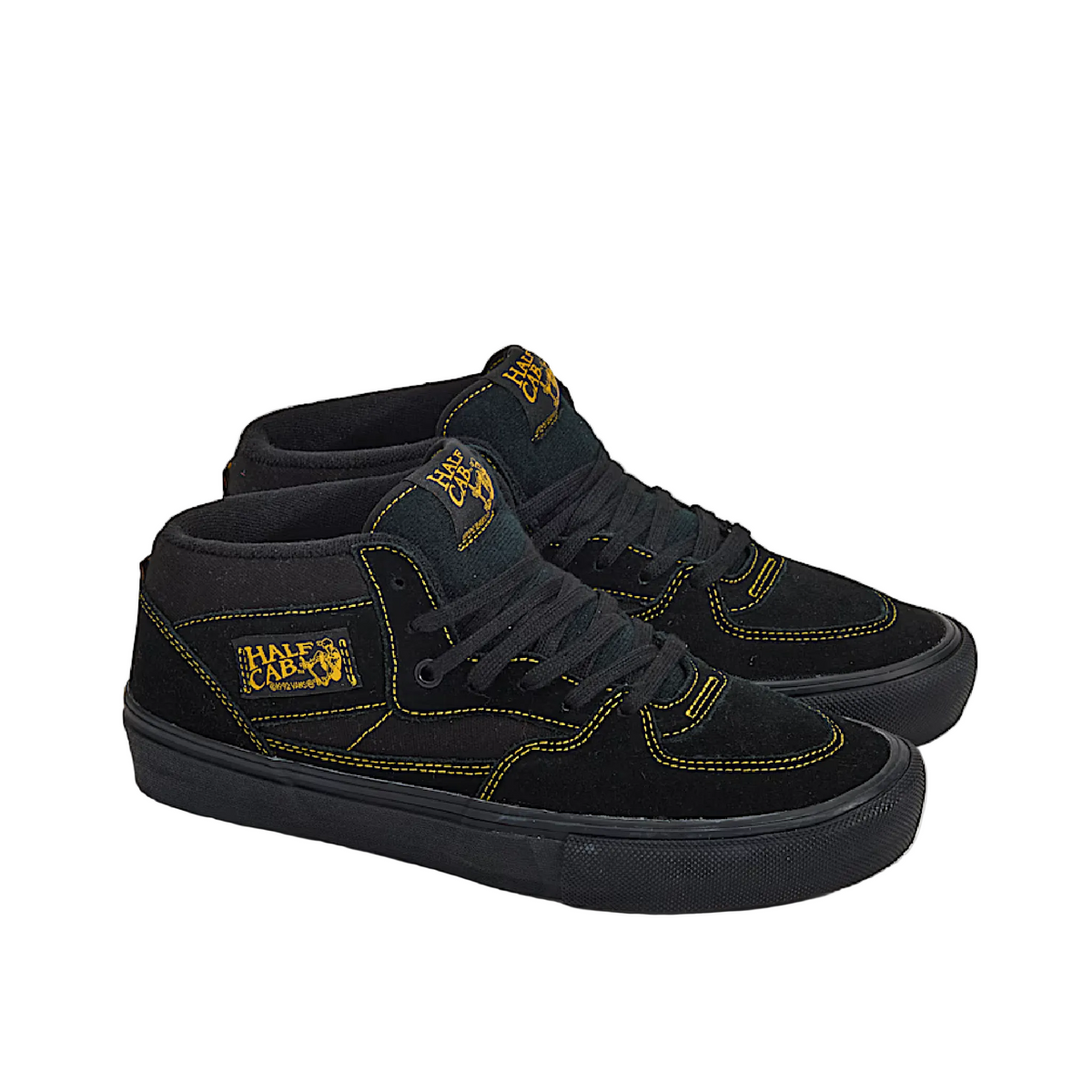 Black high-top sneakers with yellow accents on a white background