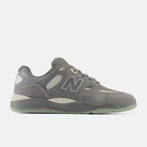 Gray sneaker with New Balance logo on a white background