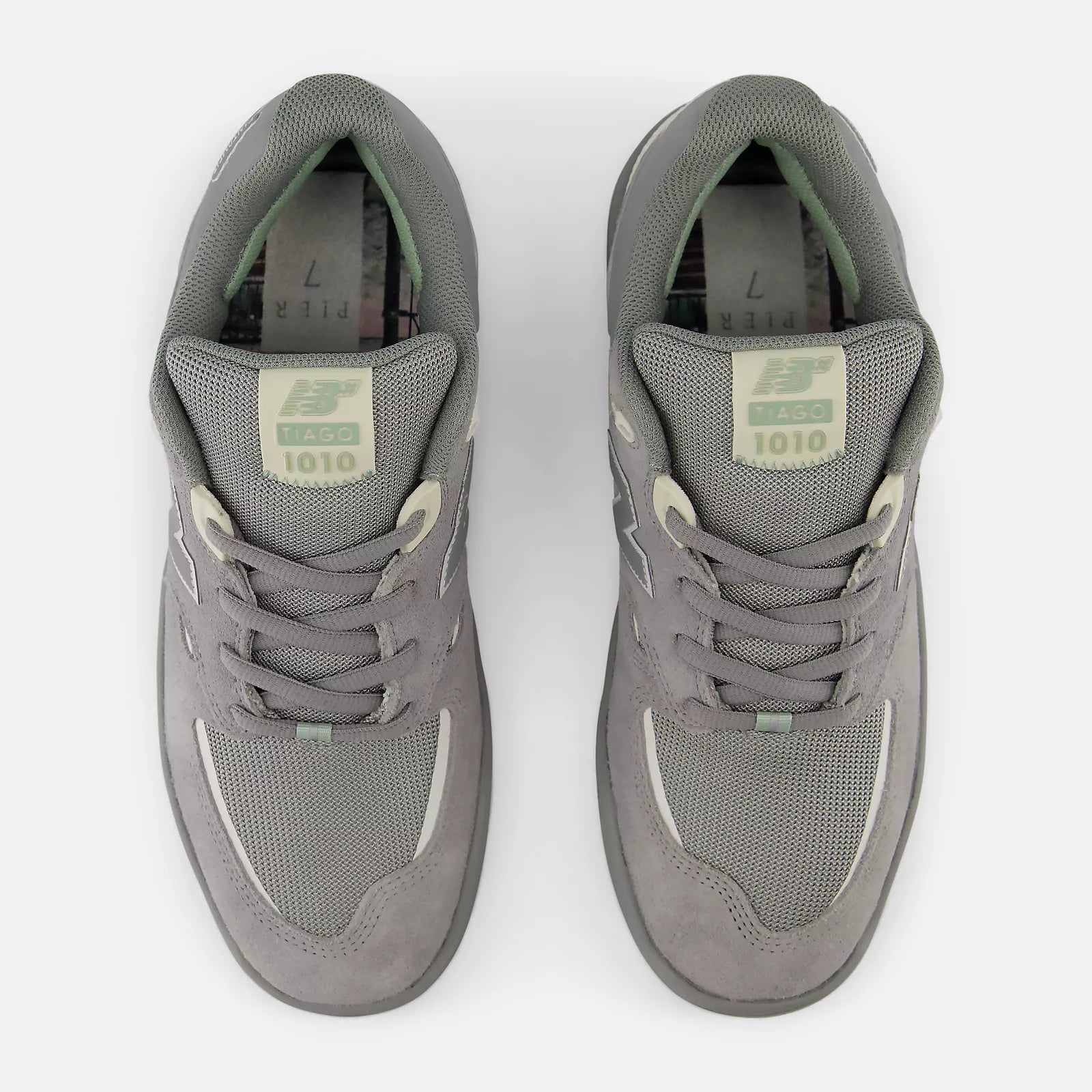 Pair of gray sneakers on a white background