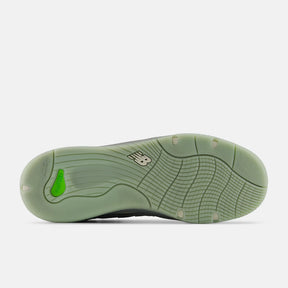 Green athletic shoe sole on a white background
