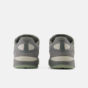 Gray athletic shoes with sole design on a white background