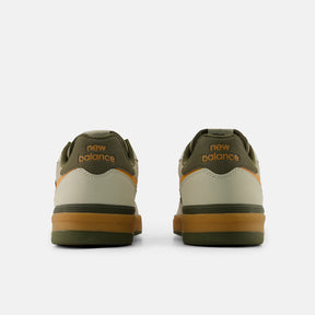 Pair of New Balance sneakers shown from the back on a white background