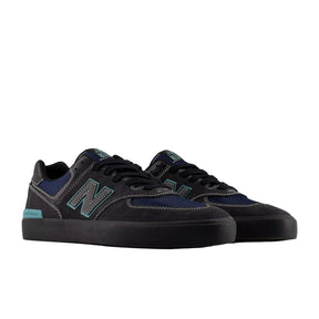Pair of black and blue sneakers on a white background